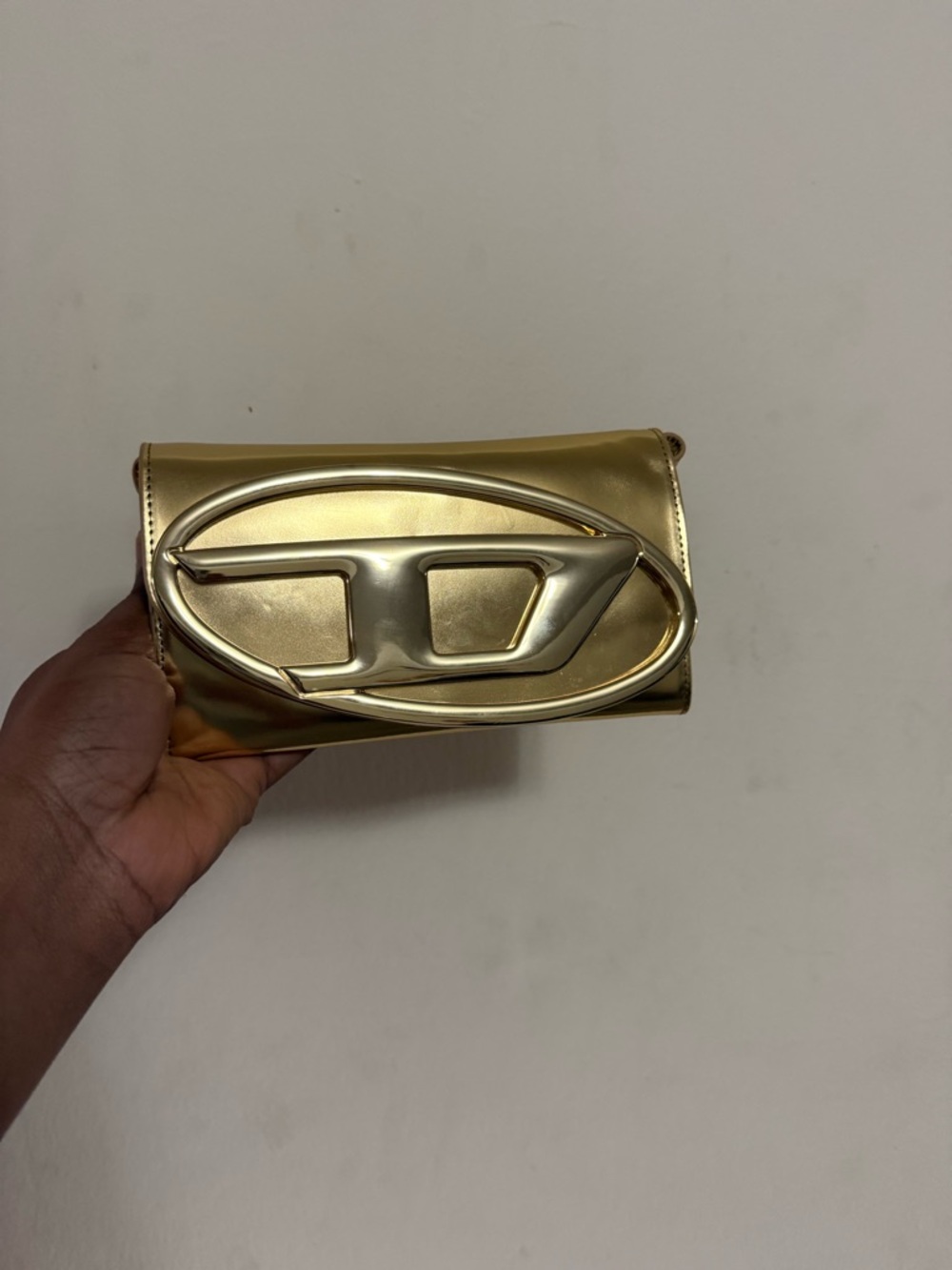 Diesel Gold Metallic Clutch with Oval Statement Emblem